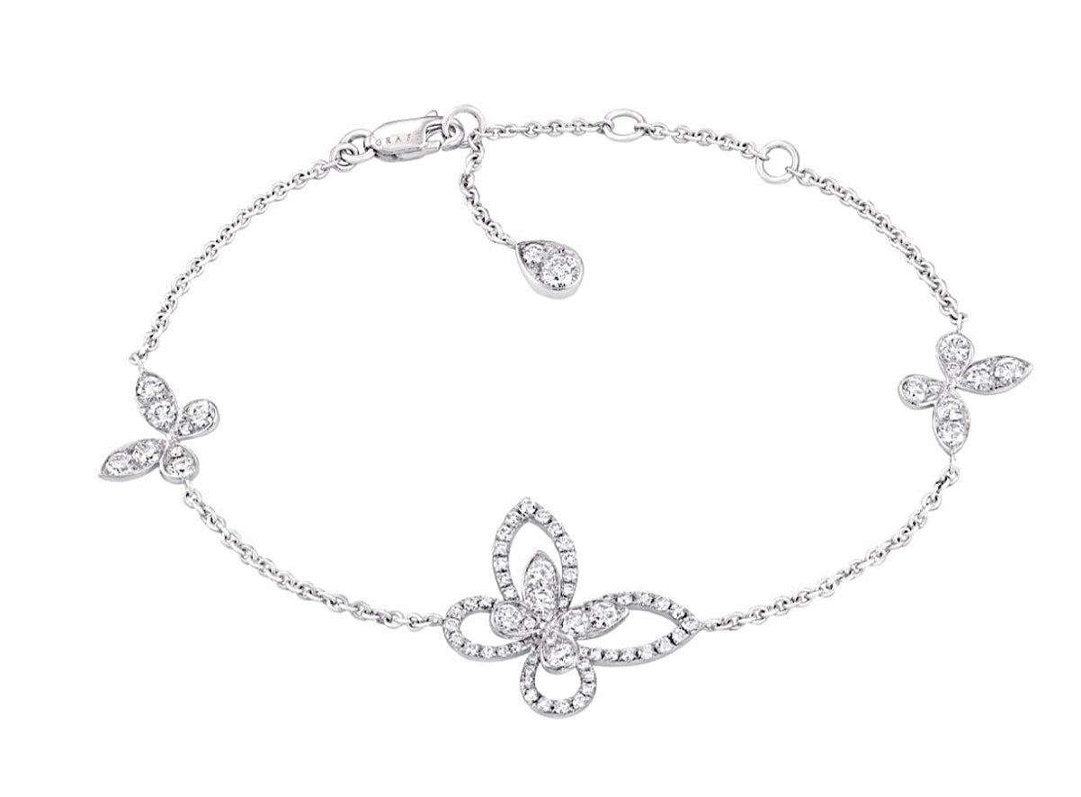 The Graff Mini Butterfly Silhouette Diamond Bracelet is crafted in 18k white gold, featuring a delicate butterfly motif set with brilliant white diamonds on a fine chain. A graceful and feminine piece from Graff's iconic collection.
