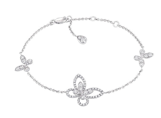 The Graff Mini Butterfly Silhouette Diamond Bracelet is crafted in 18k white gold, featuring a delicate butterfly motif set with brilliant white diamonds on a fine chain. A graceful and feminine piece from Graff's iconic collection.